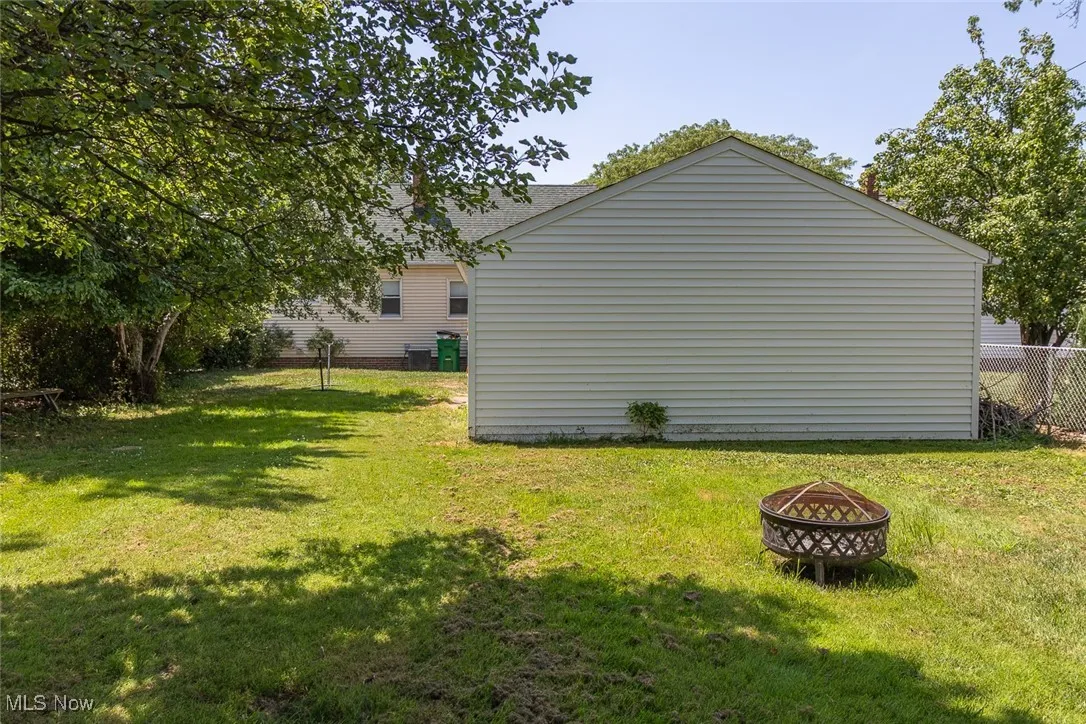 View of yard featuring a fire pit
