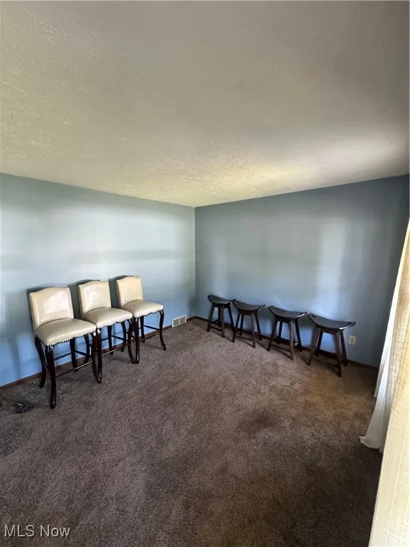 Located off of the foyer as a potential sitting room, office, or playroom
