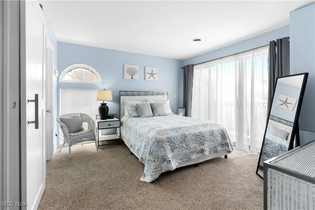 Bedroom with carpet floors and baseboards