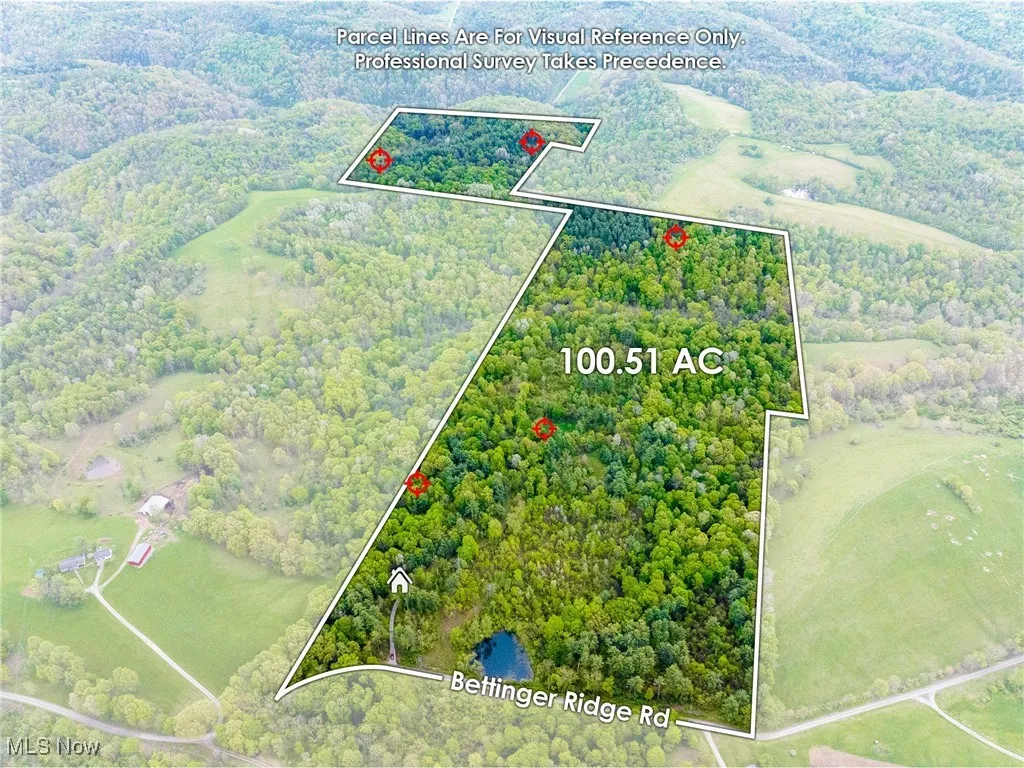 Aerial view of property and surrounding area with property parcel outlined