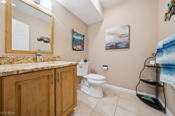 Bathroom featuring vanity and tile patterned flooring