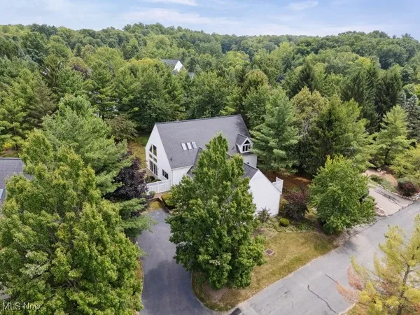 View from above of property with a forest