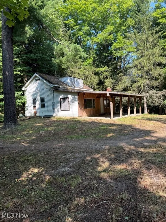 View of front of house with a carport