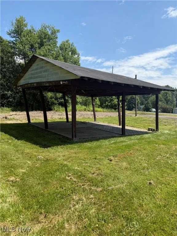 View of property's community featuring a gazebo and a lawn