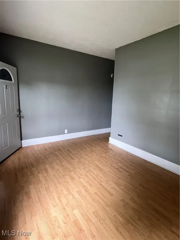 Empty room featuring light wood finished floors