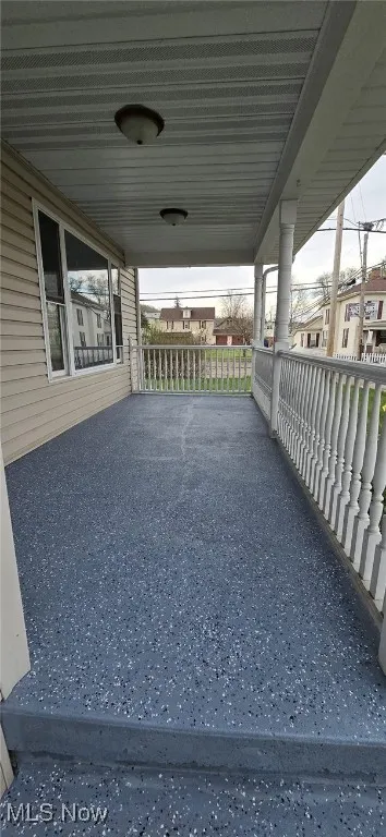 View of patio featuring an attached carport