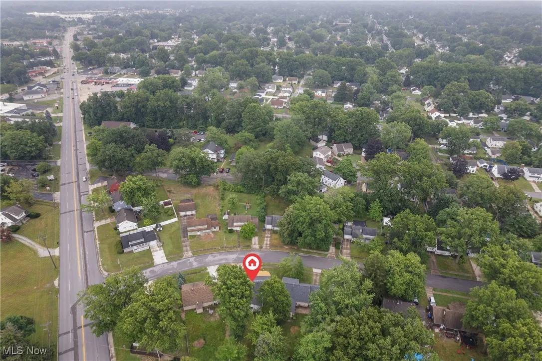View of property location with nearby suburban area