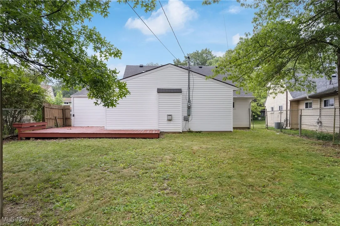 Back of property featuring a wooden deck