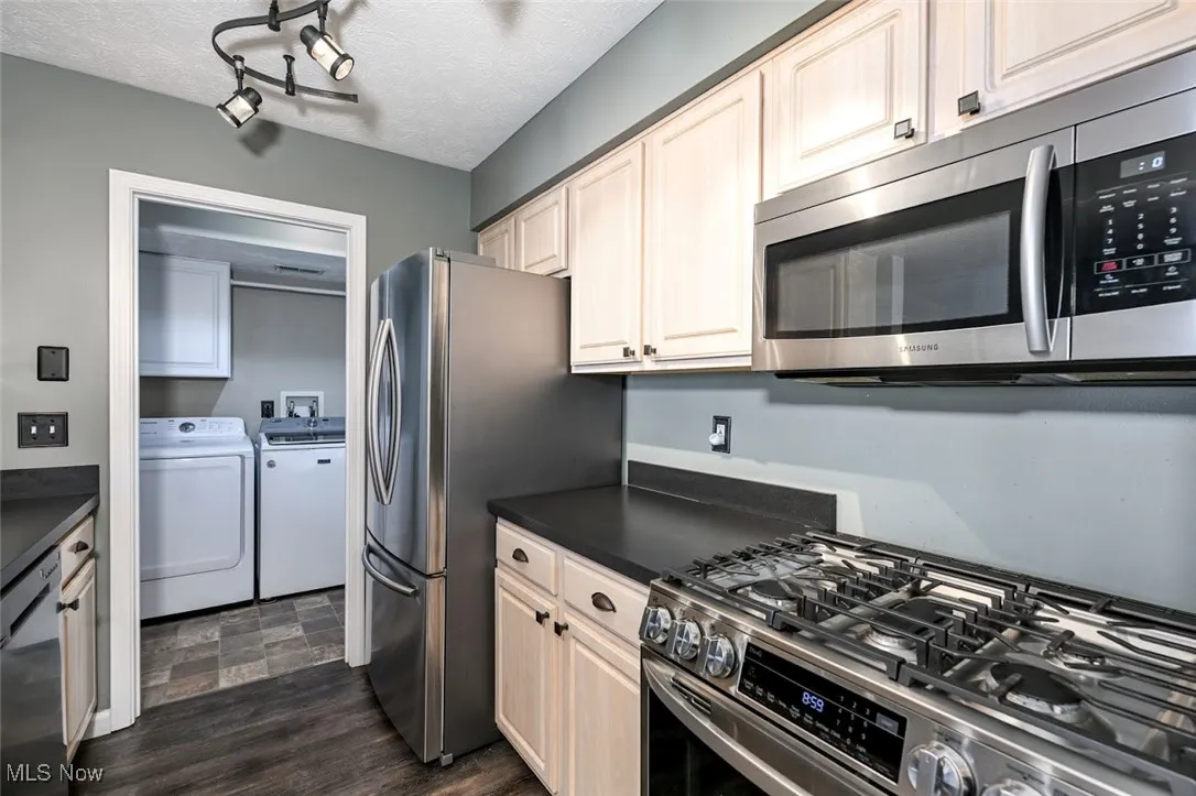 A second view of the kitchen into the laundry room