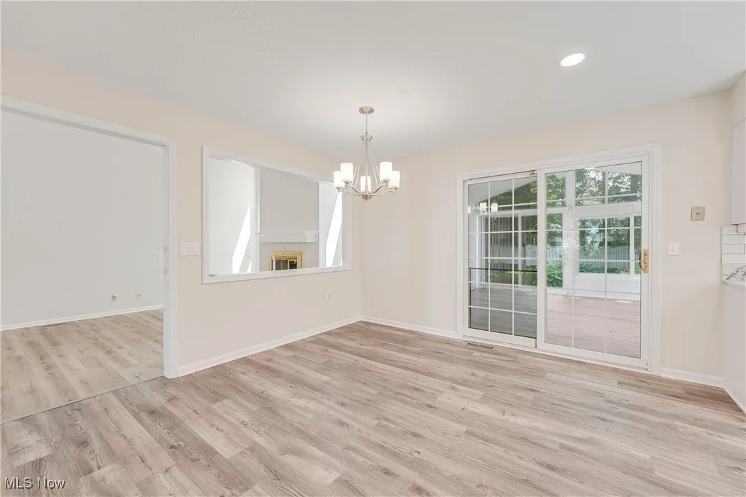 Kitchen eating area opens to a stunning sunroom