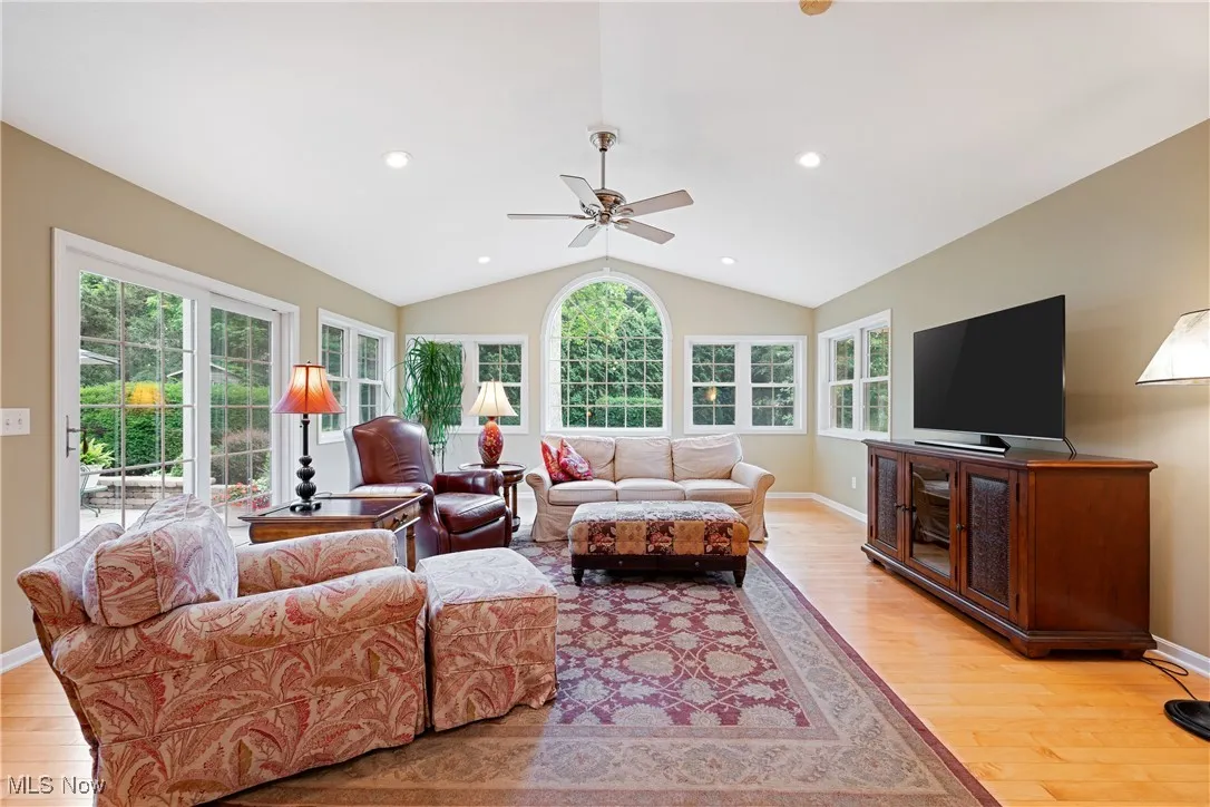 Beautiful great room with vaulted ceiling and tons of windows.