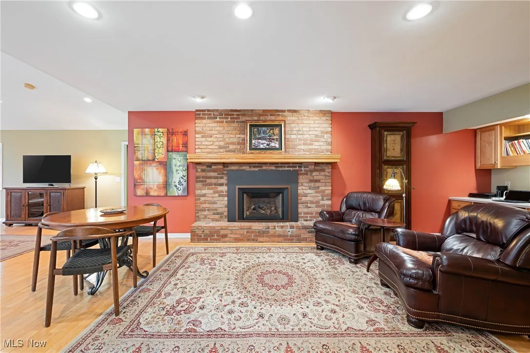 Family room adjacent to the kitchen and has a gas log fireplace.