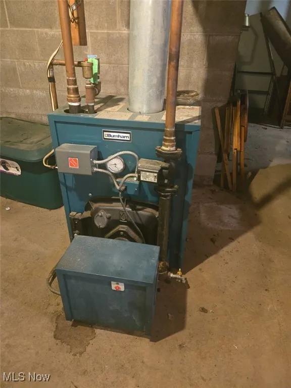Utility room featuring a heating unit