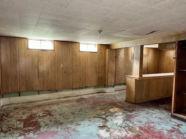 Below grade area with wood walls