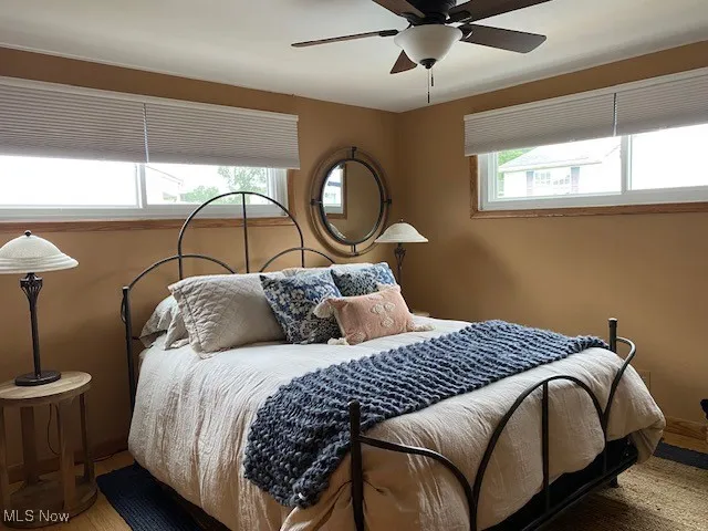 Bedroom featuring ceiling fan and wood finished floors