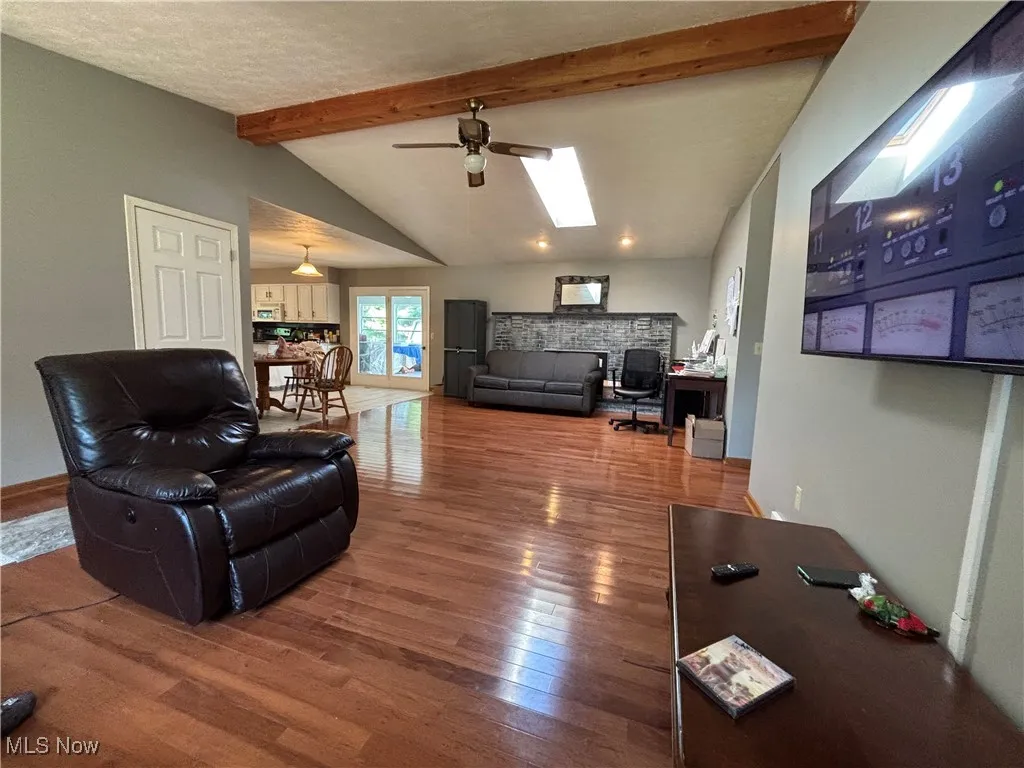 Wood burning fireplace behind the couch.