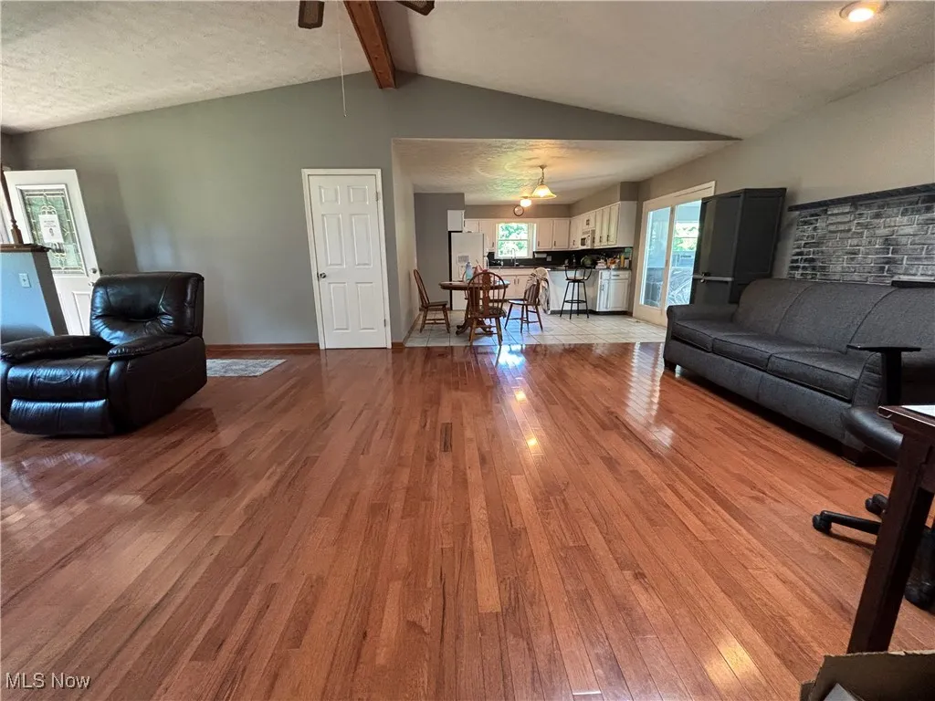 High beamed ceiling adds to the openness. Walls are neutral gray.
