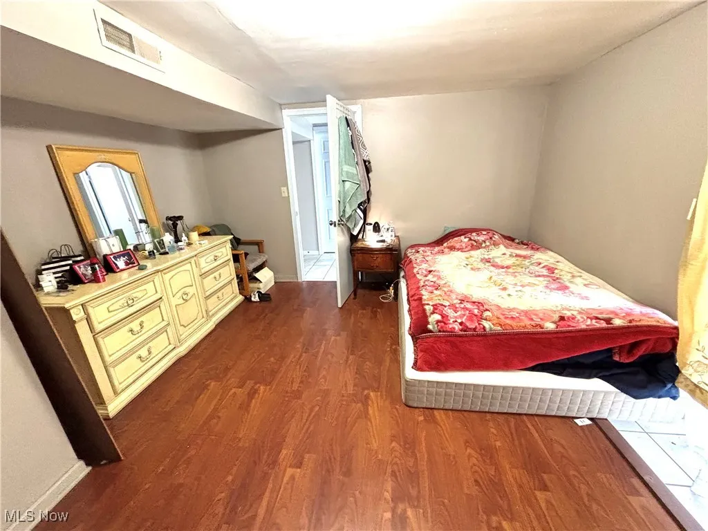 Lower level bedroom with sliding door out to patio.