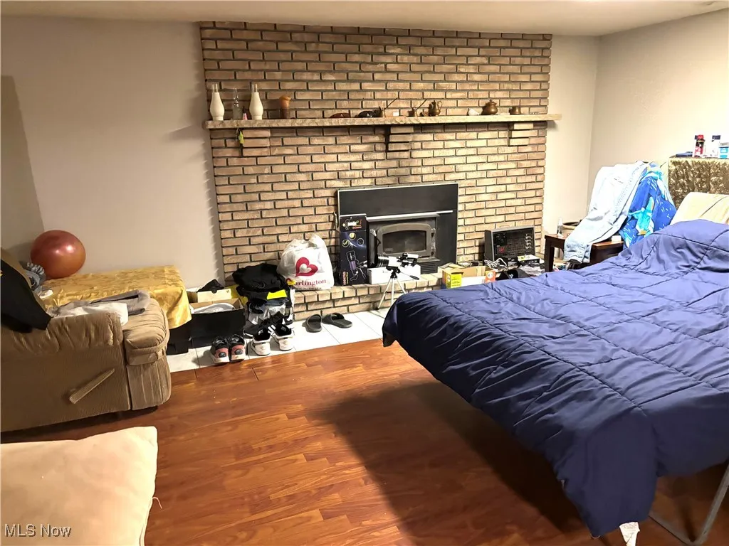 Lower level family room being used as a bedroom.