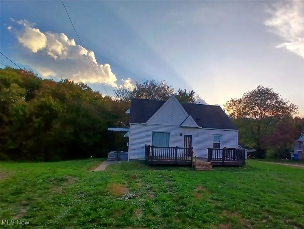 Front of house with a large deck.