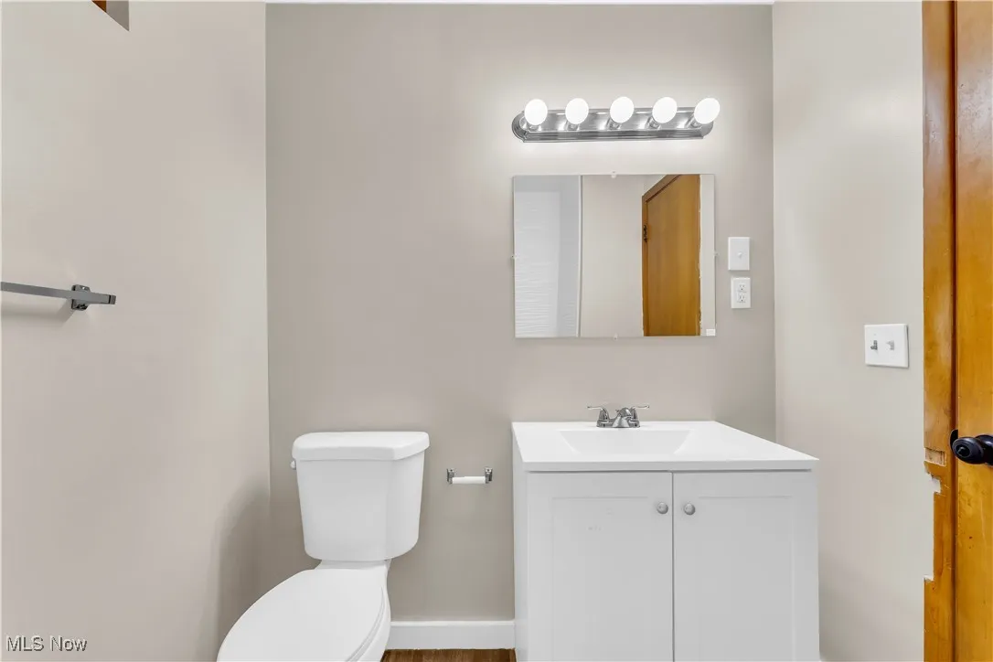 Half bath with toilet and vanity