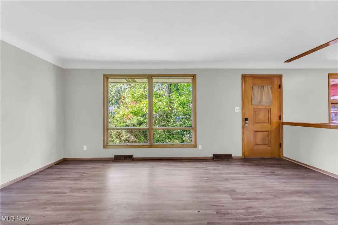 Unfurnished room featuring wood finished floors