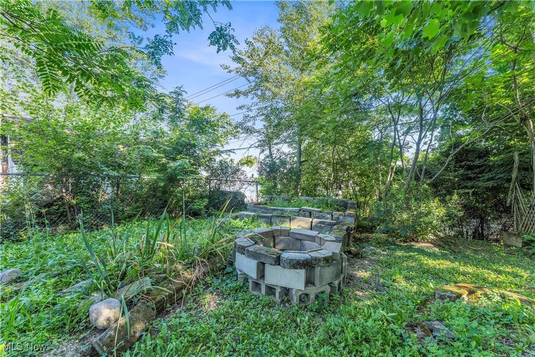 View of yard featuring an outdoor fire pit