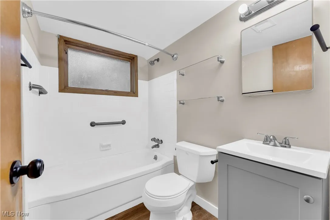 Full bathroom featuring vanity and  shower combination