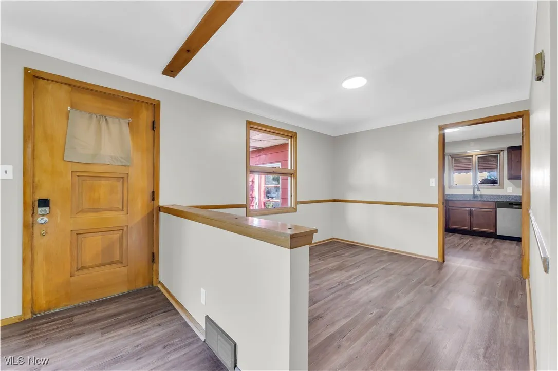 Entryway featuring wood finished floors and baseboards