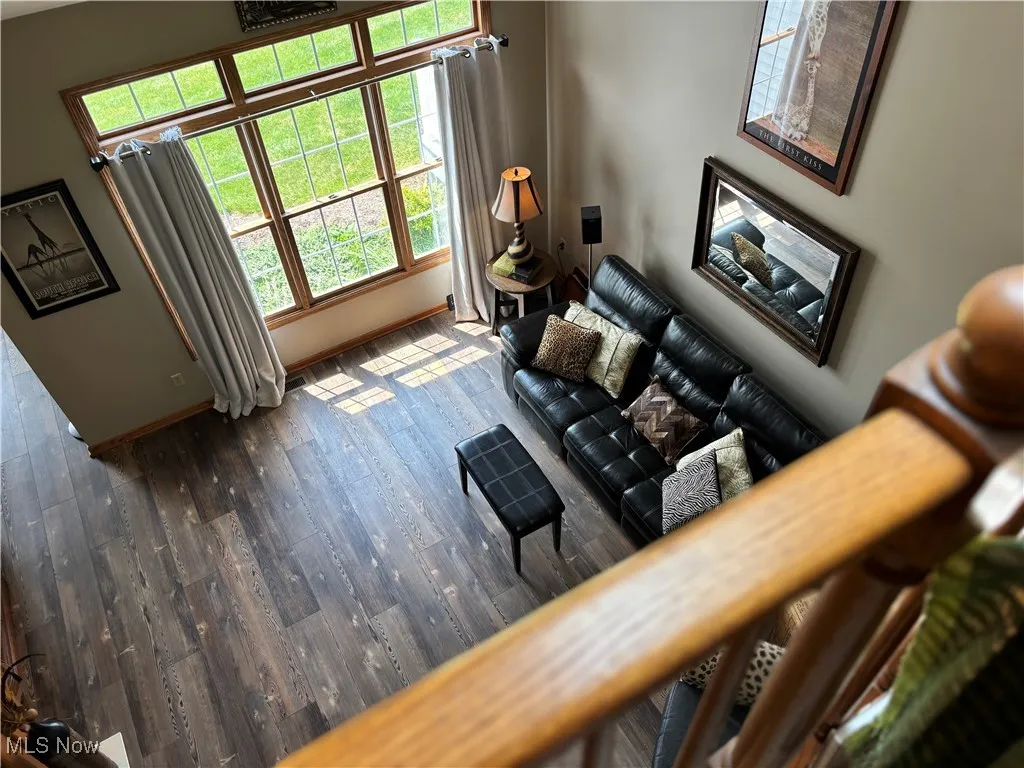 Living room with wood finished floors and baseboards