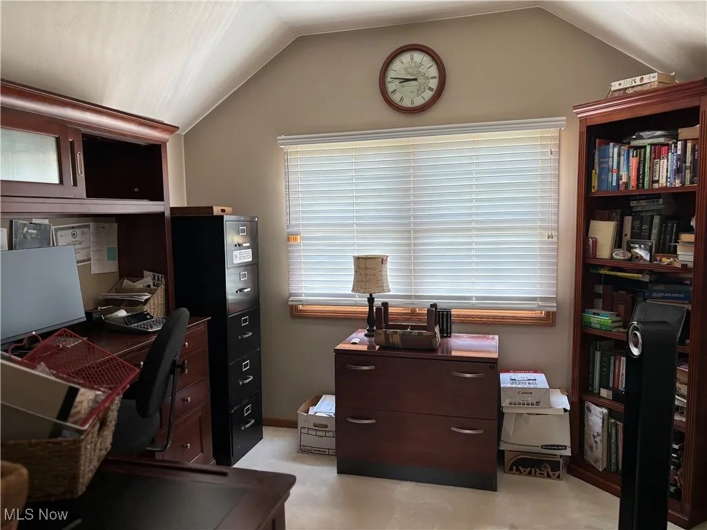 Office with lofted ceiling