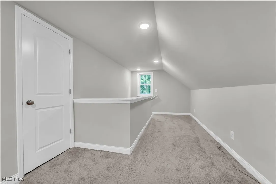 Bonus room featuring carpet flooring, lofted ceiling, and recessed lighting