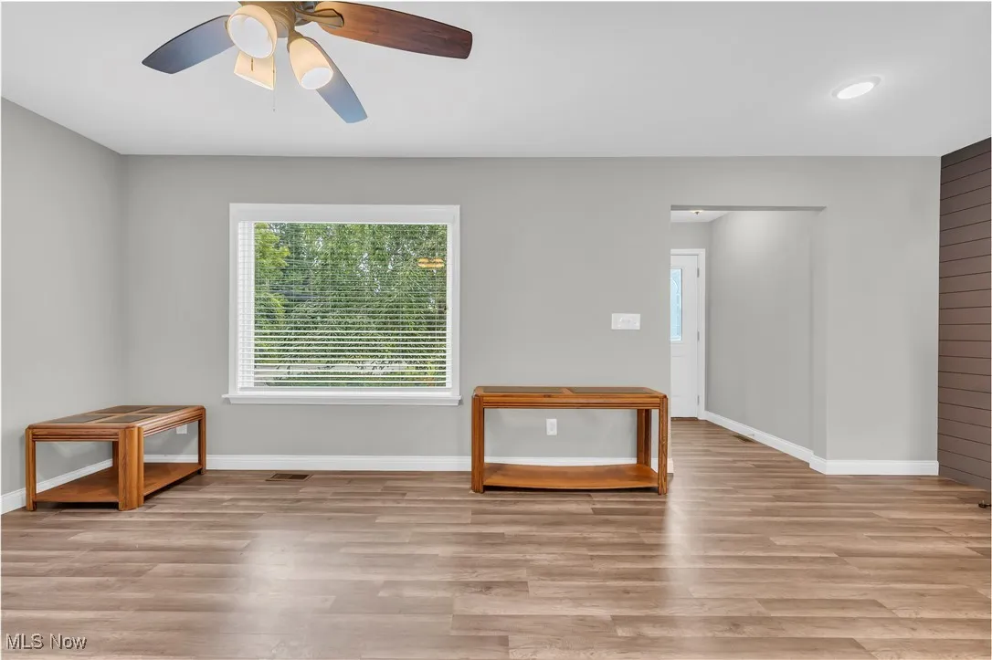 Spare room featuring wood finished floors and ceiling fan