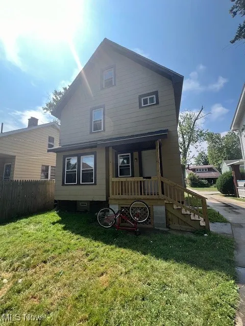View of front of house with a porch and stairs