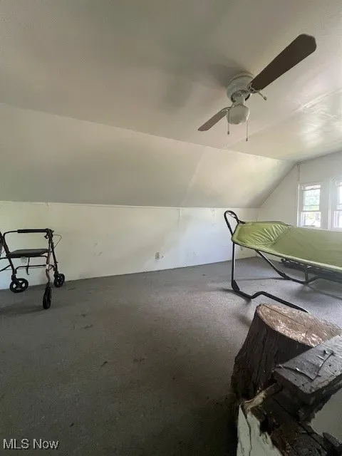 Bonus room with ceiling fan and vaulted ceiling