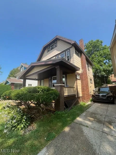 View of front of house with a chimney