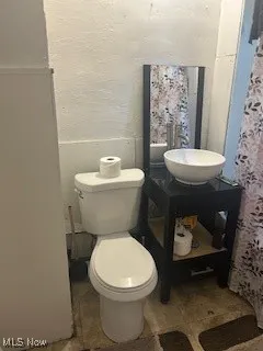 Bathroom featuring toilet and vanity