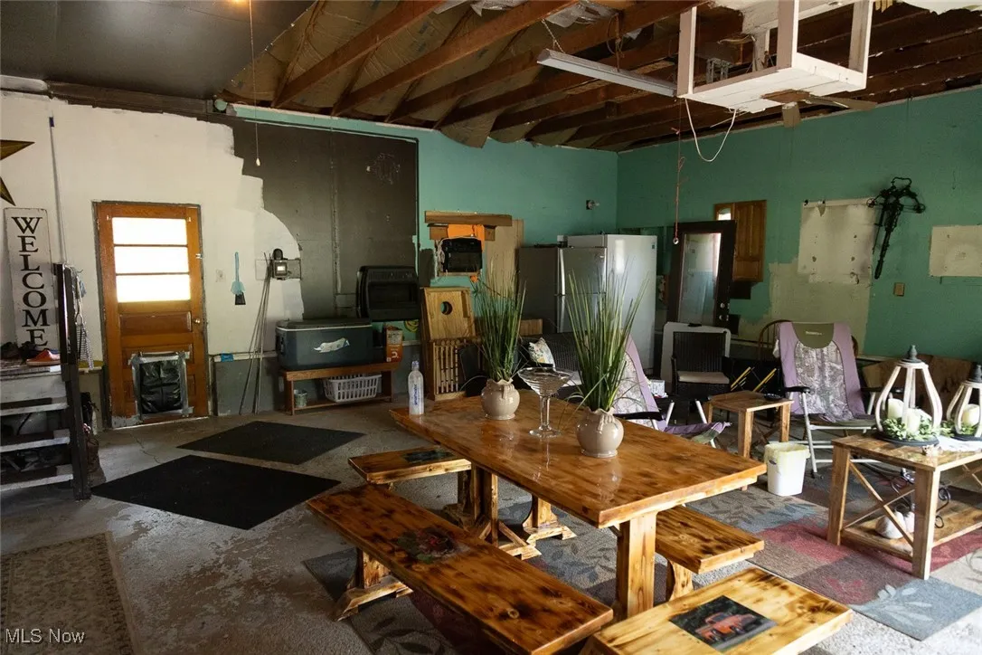 Living room with unfinished concrete flooring