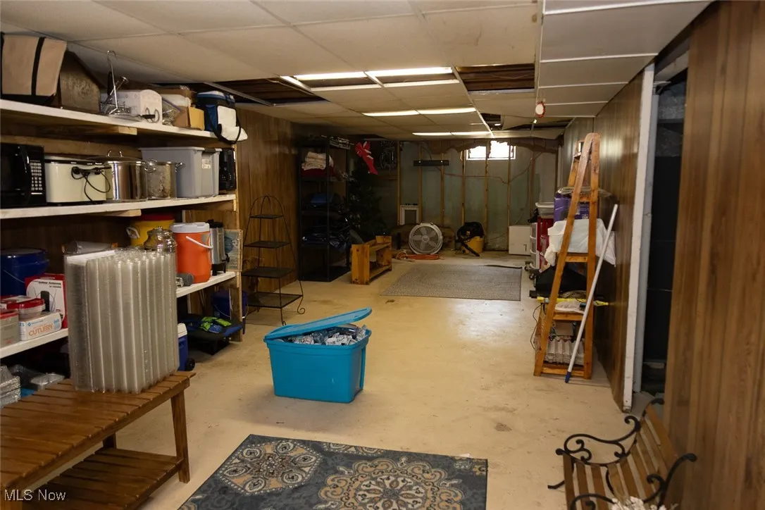 Below grade area featuring a paneled ceiling