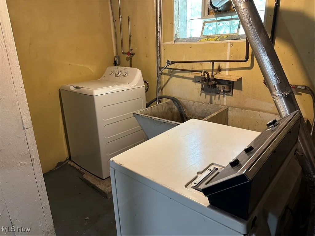 Washroom featuring washer and dryer