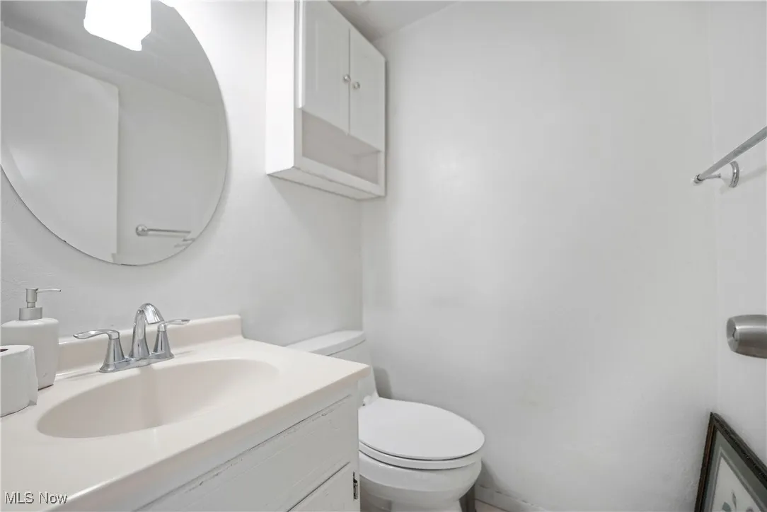 Bathroom with toilet and vanity