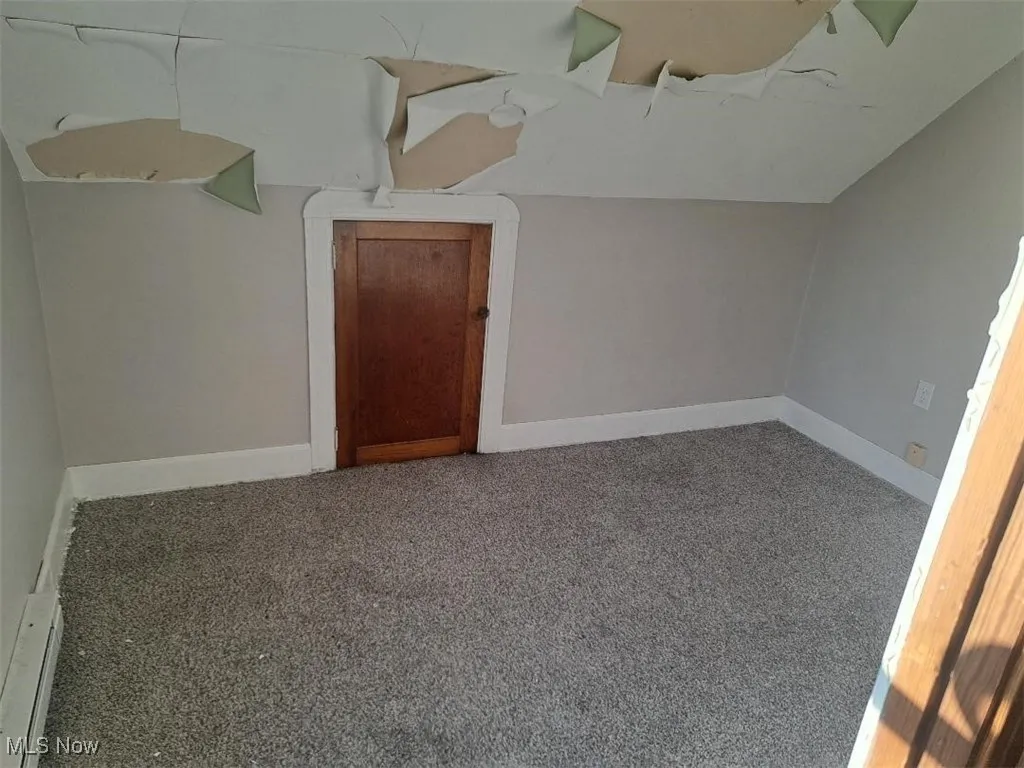 Spare room featuring carpet floors