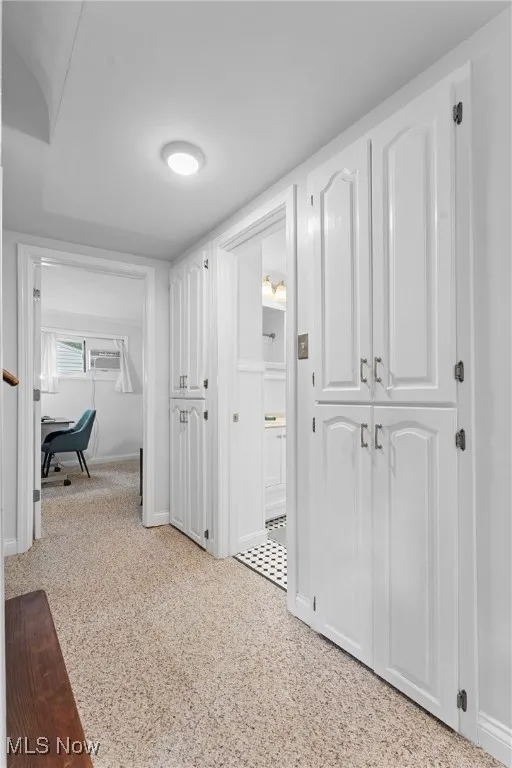 Hall featuring baseboards