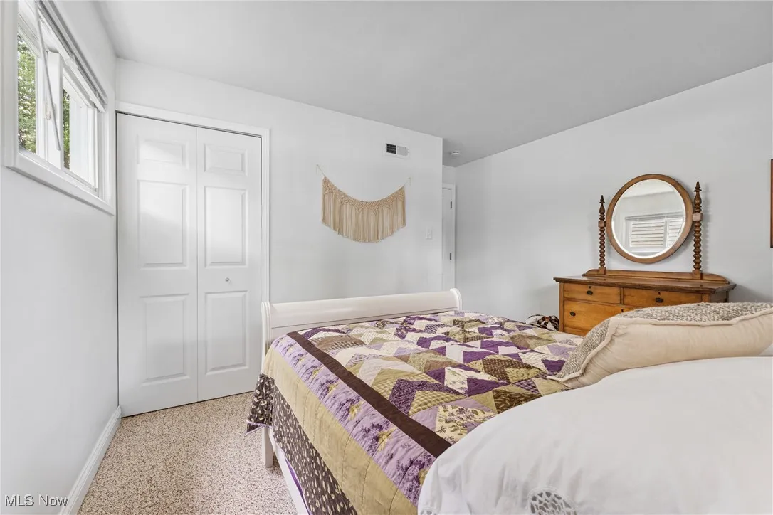 Bedroom with baseboards and a closet