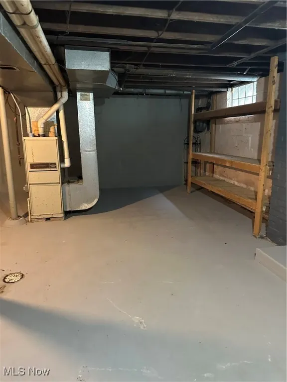 Below grade area featuring heating unit