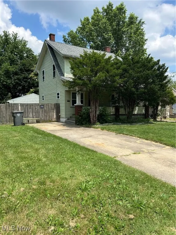 View of front of house featuring a chimney