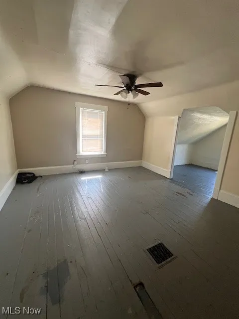 Bonus room featuring lofted ceiling, wood-type flooring, and ceiling fan