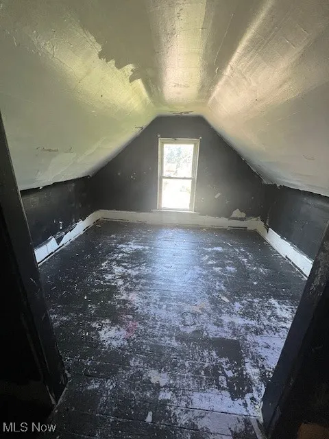 Bonus room featuring lofted ceiling