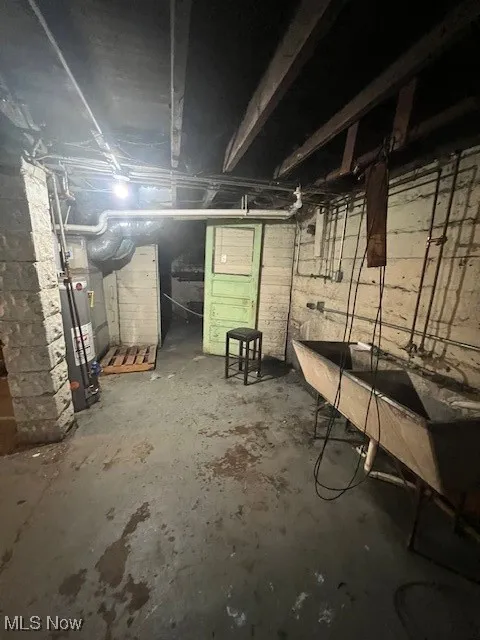 Unfinished below grade area featuring a sink