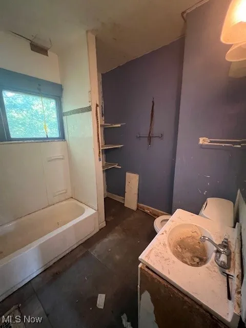 Bathroom with vanity and shower / bath combination